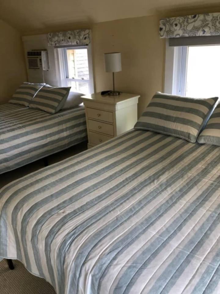 Second bedroom with striped bedding
